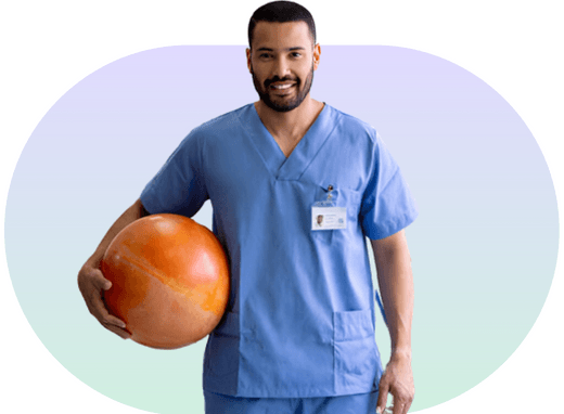 Physiotherapist in scrubs holding an exercise ball